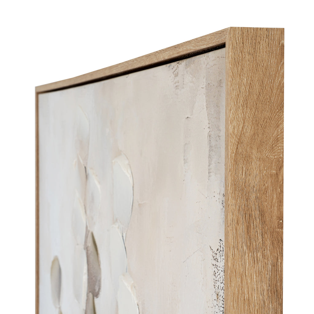 Angled close-up of the artwork's upper-right corner, showing the grain-like frame finish and pale textured surface.