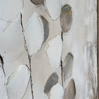 Close-up of raised pale leaf shapes, grey and taupe forms and fine dark stems across the textured canvas.