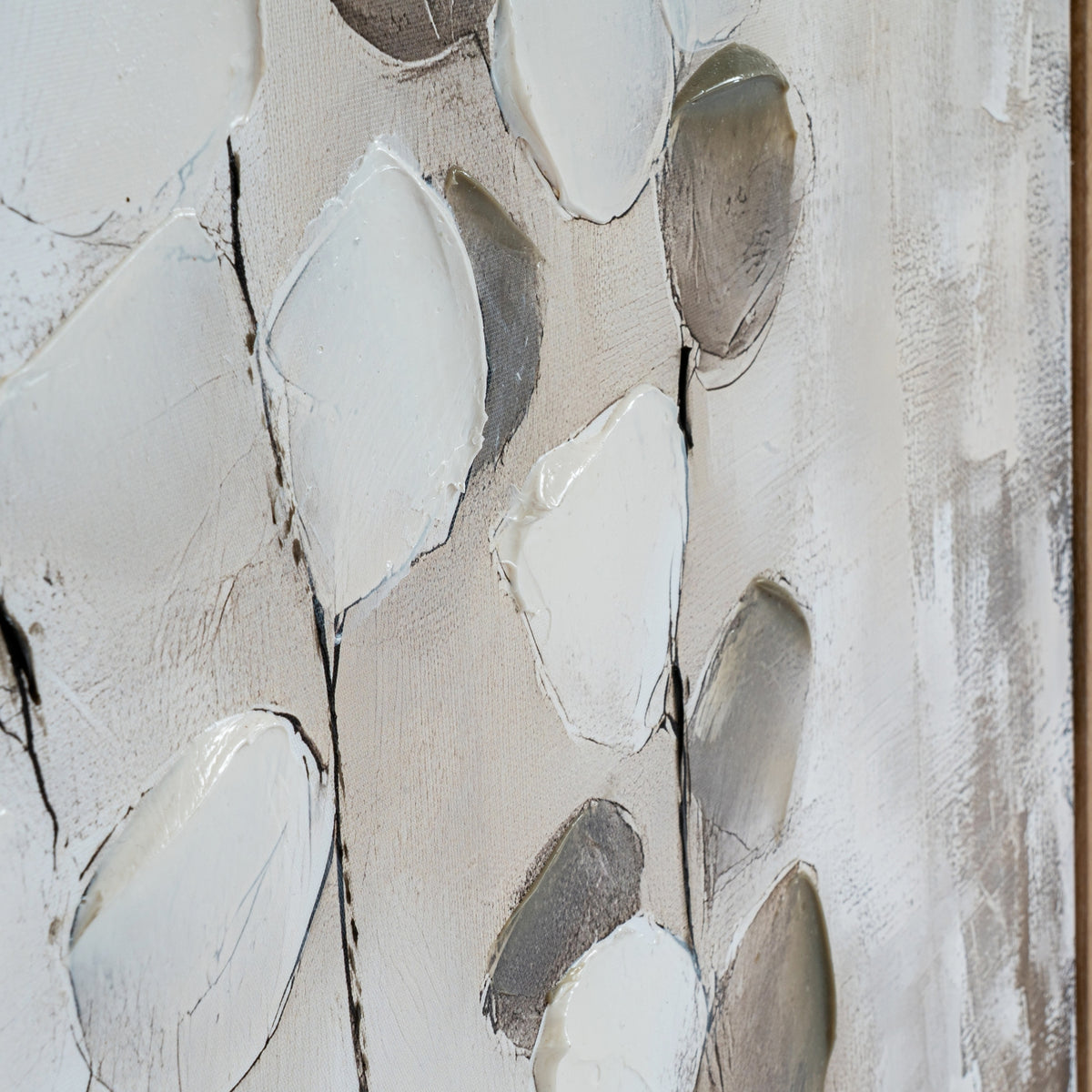 Close-up of raised pale leaf shapes, grey and taupe forms and fine dark stems across the textured canvas.