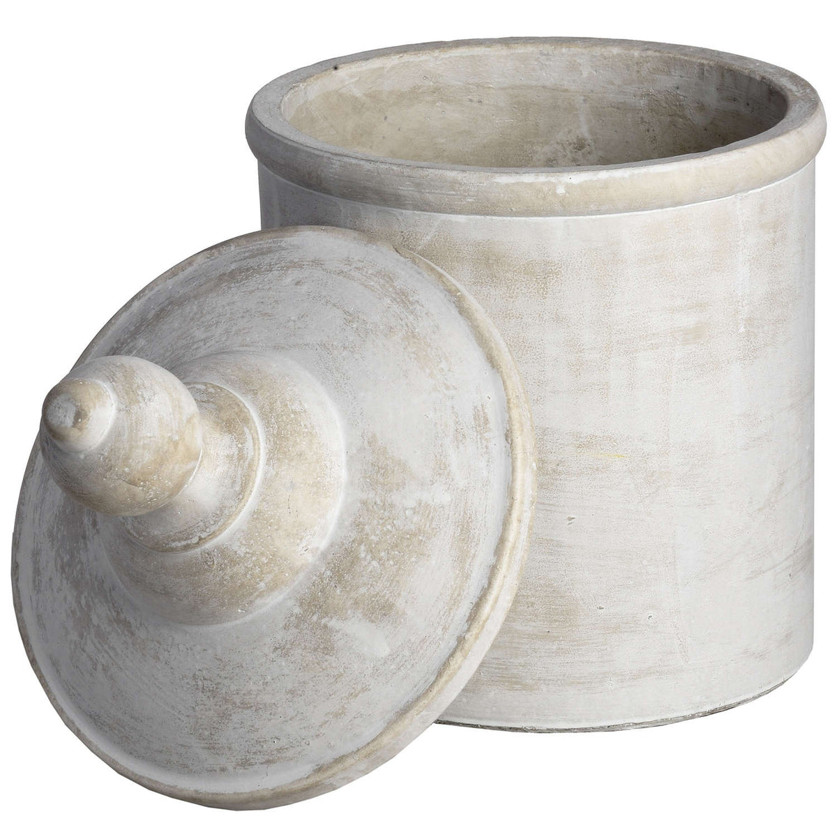 Open decorative canister with its domed lid leaning against the front, revealing the thick rounded rim and pale interior.
