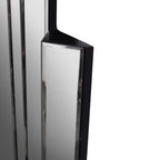 Close-up of a projecting mirror panel with a bevelled border and black painted top and side surfaces.