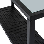 Angled close-up of the console table's reflective top corner and black square leg, with the raised geometric shelf pattern below.
