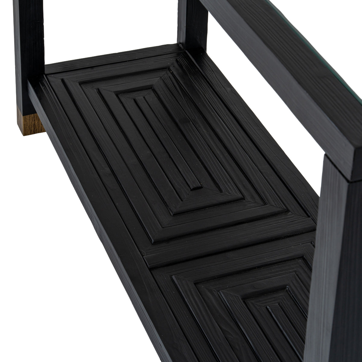 Close-up of concentric raised rectangles on the console table's black lower shelf, with a gold-toned leg cap at the left.