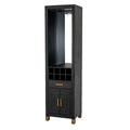 Three-quarter view of a tall black drinks cabinet with a reflective open bay, overhead rack, eight cubbies and gold-toned handles.