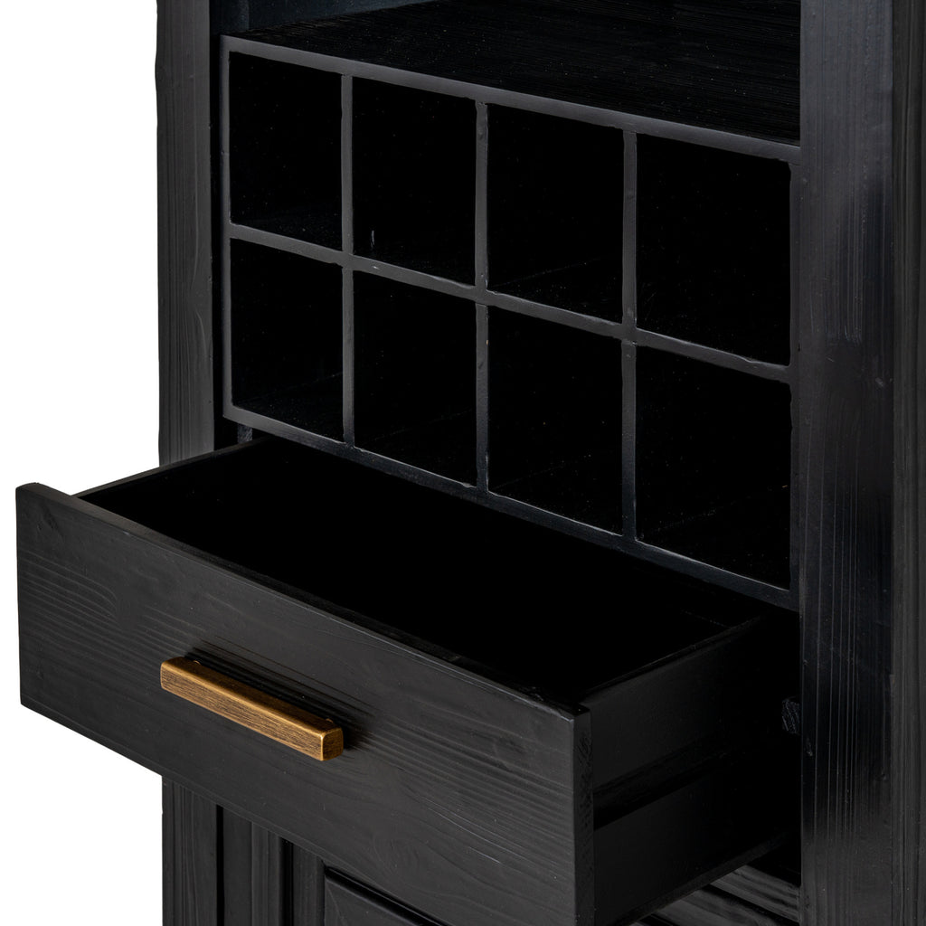 Close-up of the eight square cubbies above an open black drawer with visible grain and a gold-toned bar handle.