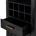 Close-up of the eight square cubbies above an open black drawer with visible grain and a gold-toned bar handle.