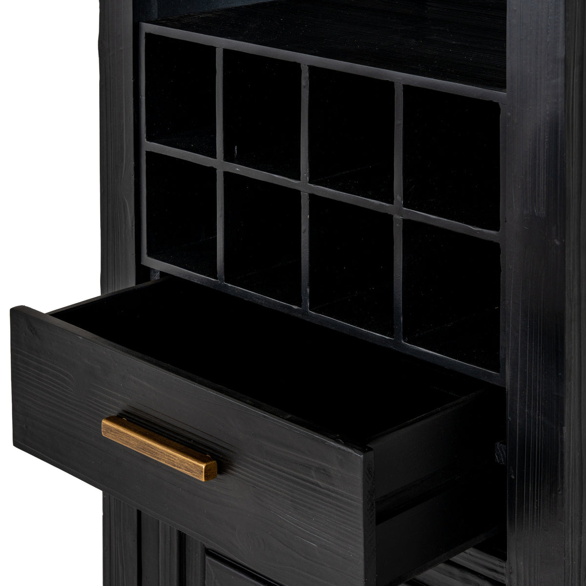 Close-up of the eight square cubbies above an open black drawer with visible grain and a gold-toned bar handle.