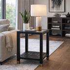 Stepped Loop Side Table beside a cream sofa, styled with a pale lamp, books, a small bowl and a potted plant.