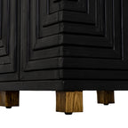 Close-up of the cabinet's lower corner, showing raised black strips continuing around the side above natural-toned block feet.