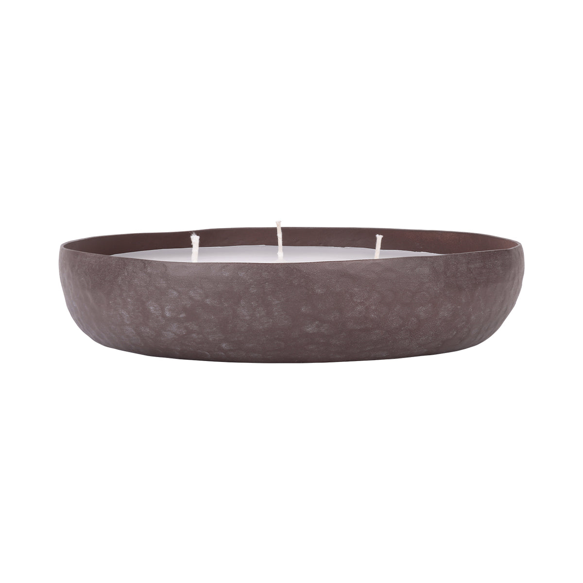 Low side view of the brown bowl candle, showing its rounded shallow profile and three wicks above the rim.