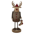 Front view of a rustic reindeer decoration with pale antlers, a red cap and nose, three red buttons and a spotted stocking, standing on a round base.
