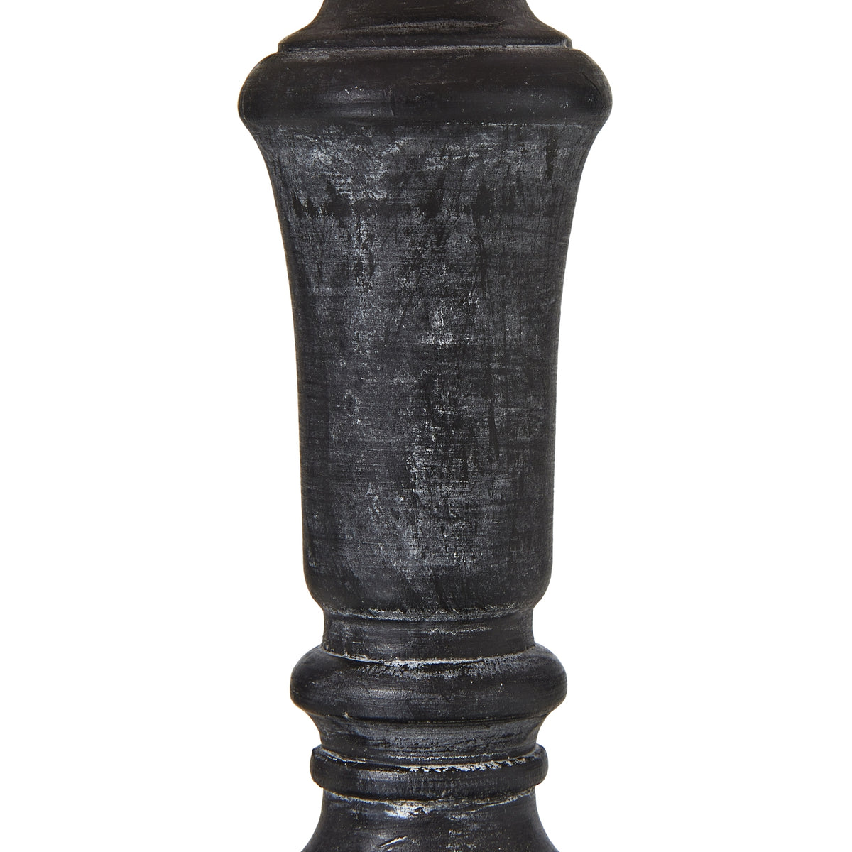 Close-up of the dark lamp column showing pale rubbed marks across its tapered centre and rounded collars.