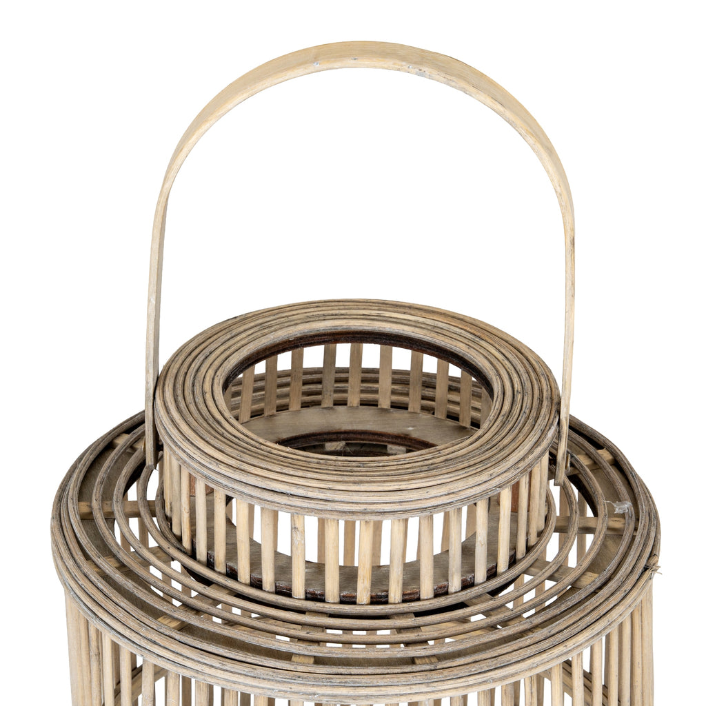View down towards the lantern's open circular neck, showing concentric rim bands, vertical slats and the broad handle arch.