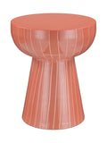 Coral pedestal side table on a white background, with a flat round top, curved upper section and flared base traced with fine pale vertical stripes.