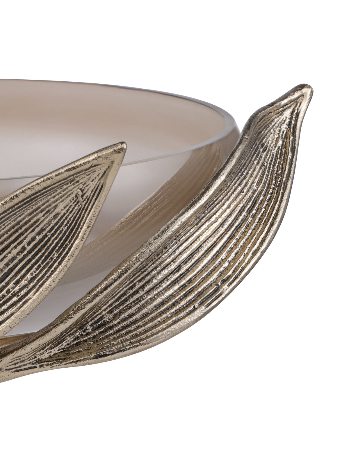 Close-up of the larger sweeping leaf, showing dark grooves in its antique gold finish beside the smooth glass bowl.
