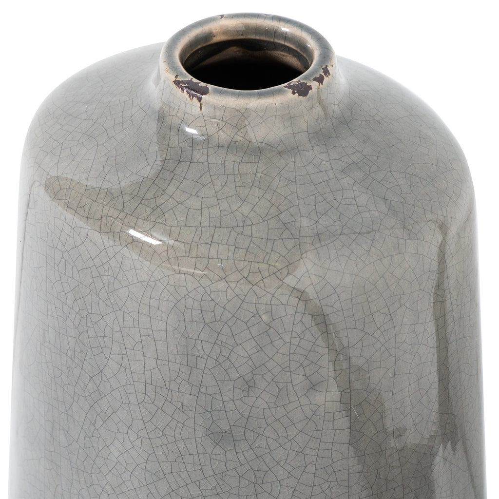 Close-up of the vase's round opening and curved shoulders, showing dark patches along the rim and the grey crackle glaze.