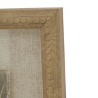 Close-up of the upper right frame corner, showing rounded beading, a textured tan-gold finish and the pale woven-looking surround.
