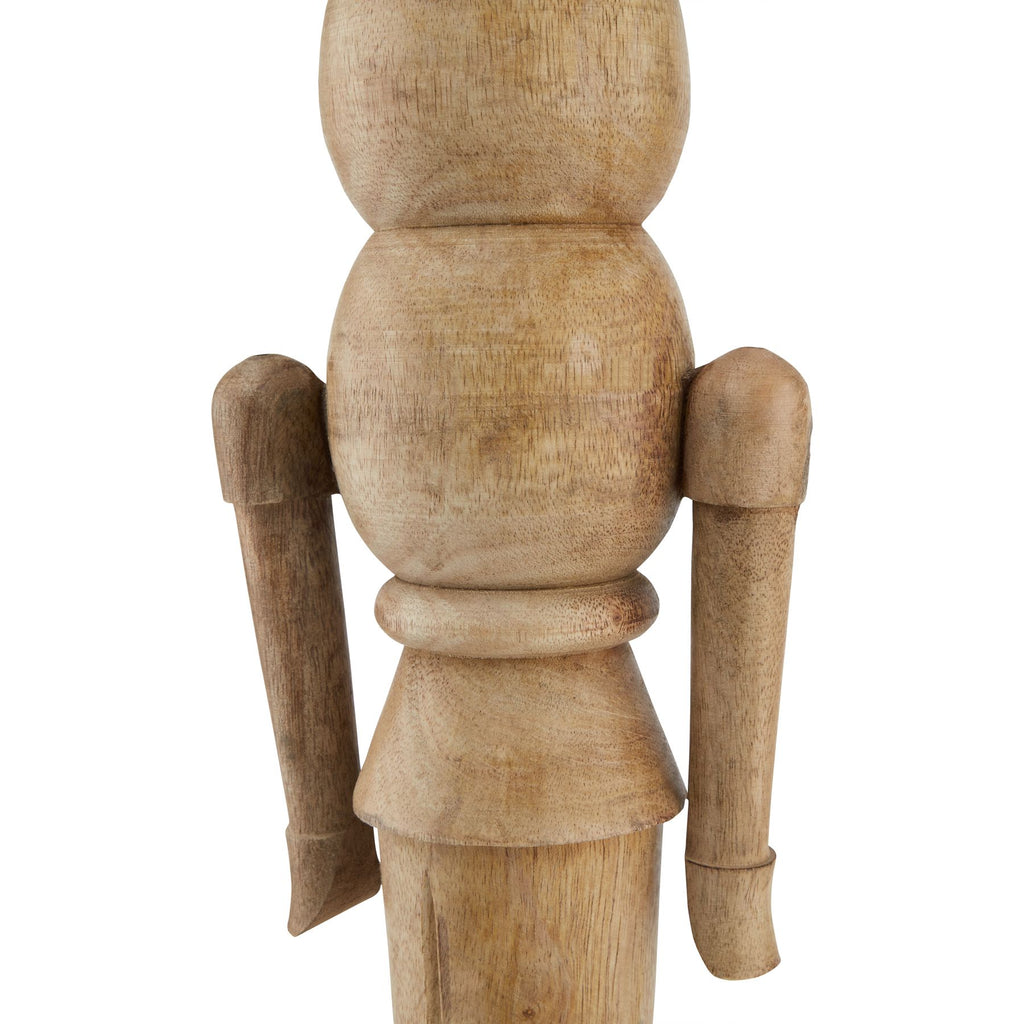 Close-up of the ornament's rounded torso, long arms and flared waist detail, showing fine brown surface markings.