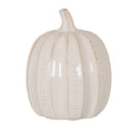 Pale cream pumpkin ornament with tan-lined vertical grooves, fine horizontal ribbing and a curved stem against a white background.