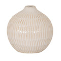 Cream vase with tan-accented vertical grooves, a broad rounded body, sloping shoulders and a small circular opening, shown against white.