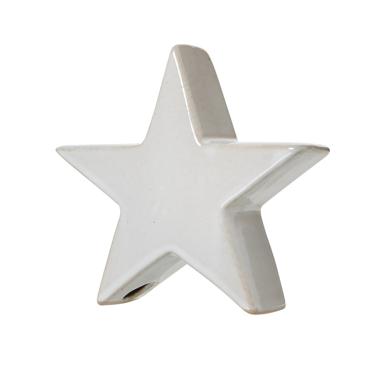 Angled view of the standing star showing its thick profile, lightly speckled face and tan edges at the lower points.