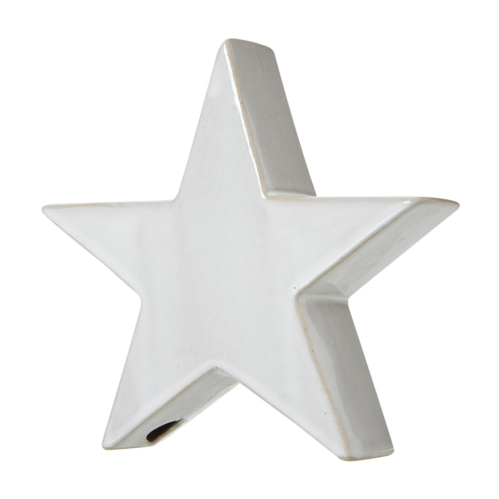 Angled view of the glossy off-white standing star showing its thick side profile and tan outline.