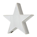 Angled view of the glossy off-white standing star showing its thick side profile and tan outline.