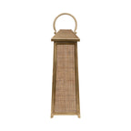 Front view of the tapered lantern with its woven rattan door closed beneath a sloping top and round handle.
