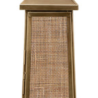 Close-up of the square rattan weave on the lantern door, bordered by an antique brass finish frame with hinges at the side.