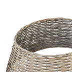 Close-up looking into the tree collar's circular opening, with the curved rim, darker inner weave and visible support grid.