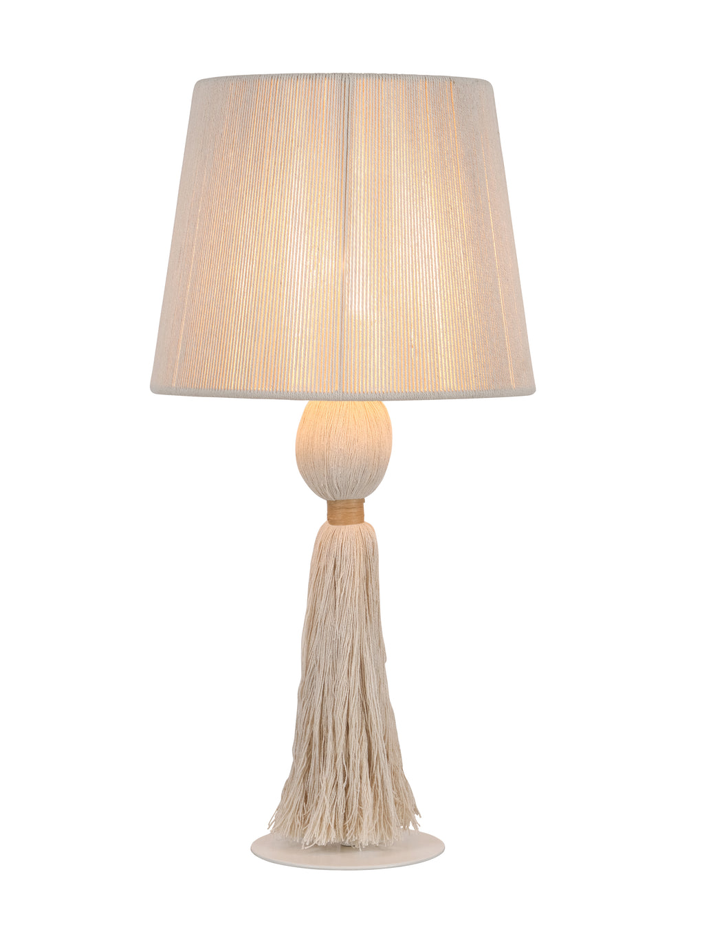 Cream tassel table lamp switched on, with warm light visible through the vertical cords of the tapered shade.