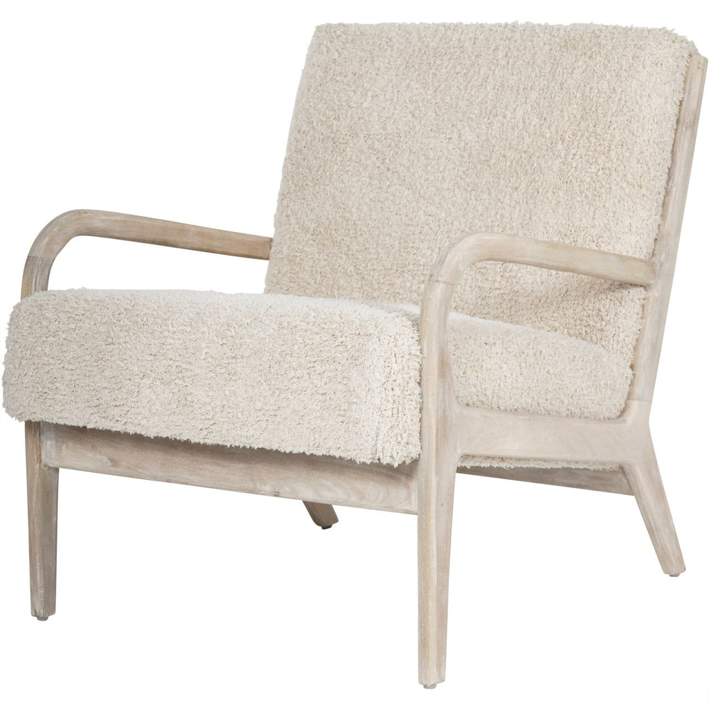 Front three-quarter view of the Teddy chair with pale textured upholstery and curved whitewashed wooden arms.
