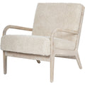 Front three-quarter view of the Teddy chair with pale textured upholstery and curved whitewashed wooden arms.