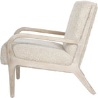 Side view of the Teddy chair showing the open wooden frame, upholstered seat and back, and angled rear leg.