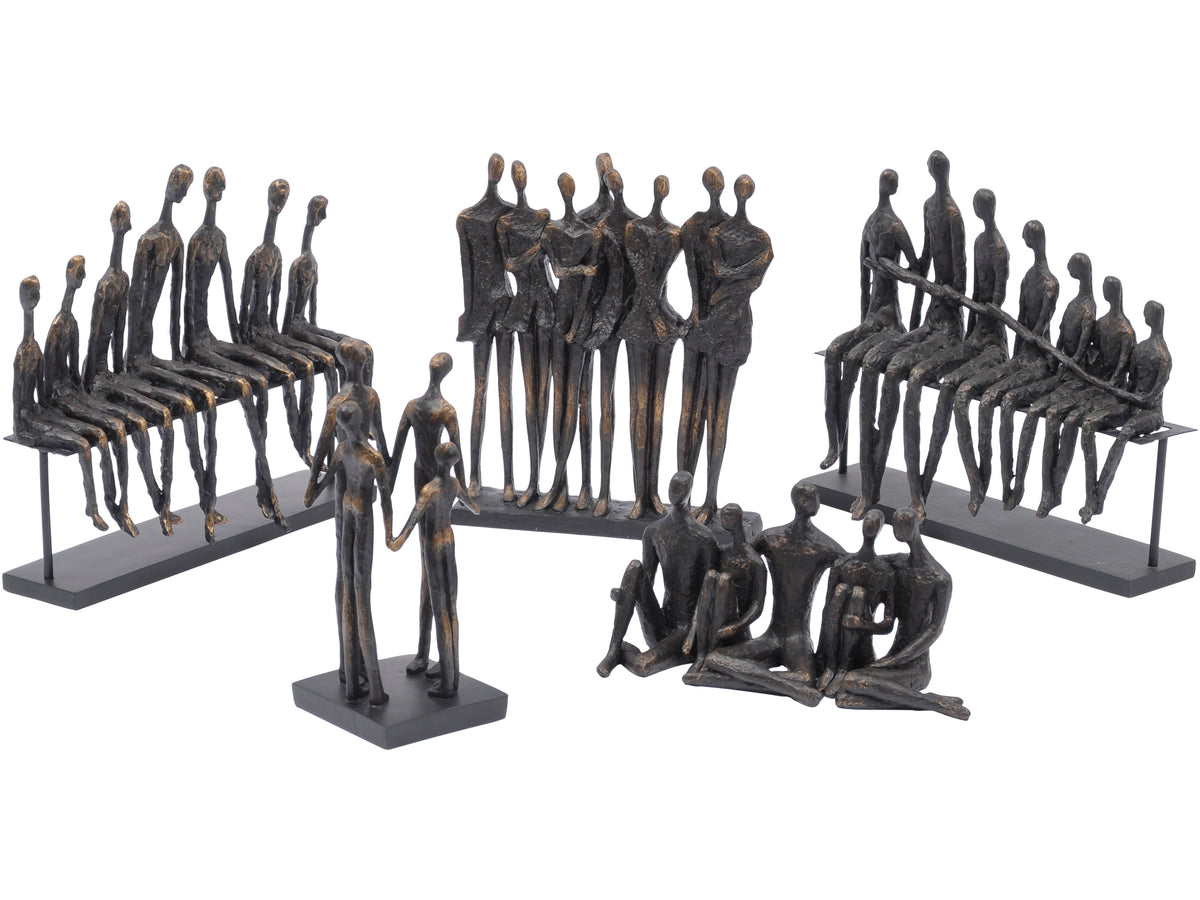 Group of dark figurative sculptures on white, with the Assembly Bench Sculpture showing seven seated figures at the left.