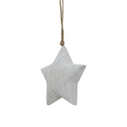 Close view of the whitewashed star's thick shaped face, rounded edges and darker surface markings, with a knotted cord above.