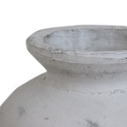 Close-up of the vase's thick rim and open neck, with layered white-grey texture and darker markings.