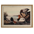 Front view of the framed print showing three brown, black and pale ducks at the water's edge, within a pale surround and tan-gold beaded frame.