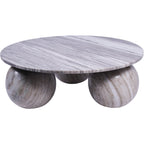 Angled view of a round, grey-veined marble coffee table with three spherical feet against a white background.