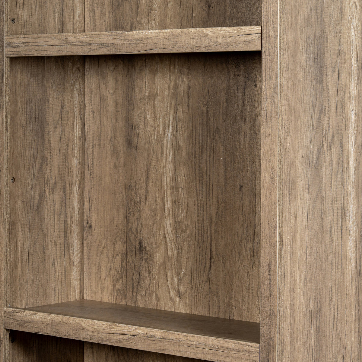 Close-up of a shelving bay and the right outer side, with pale streaks and dark grain lines across the brown surfaces.