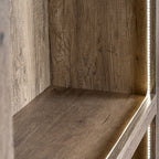 Close-up inside a shelf bay, showing the brown grain pattern and a bright vertical strip beside the right edge.