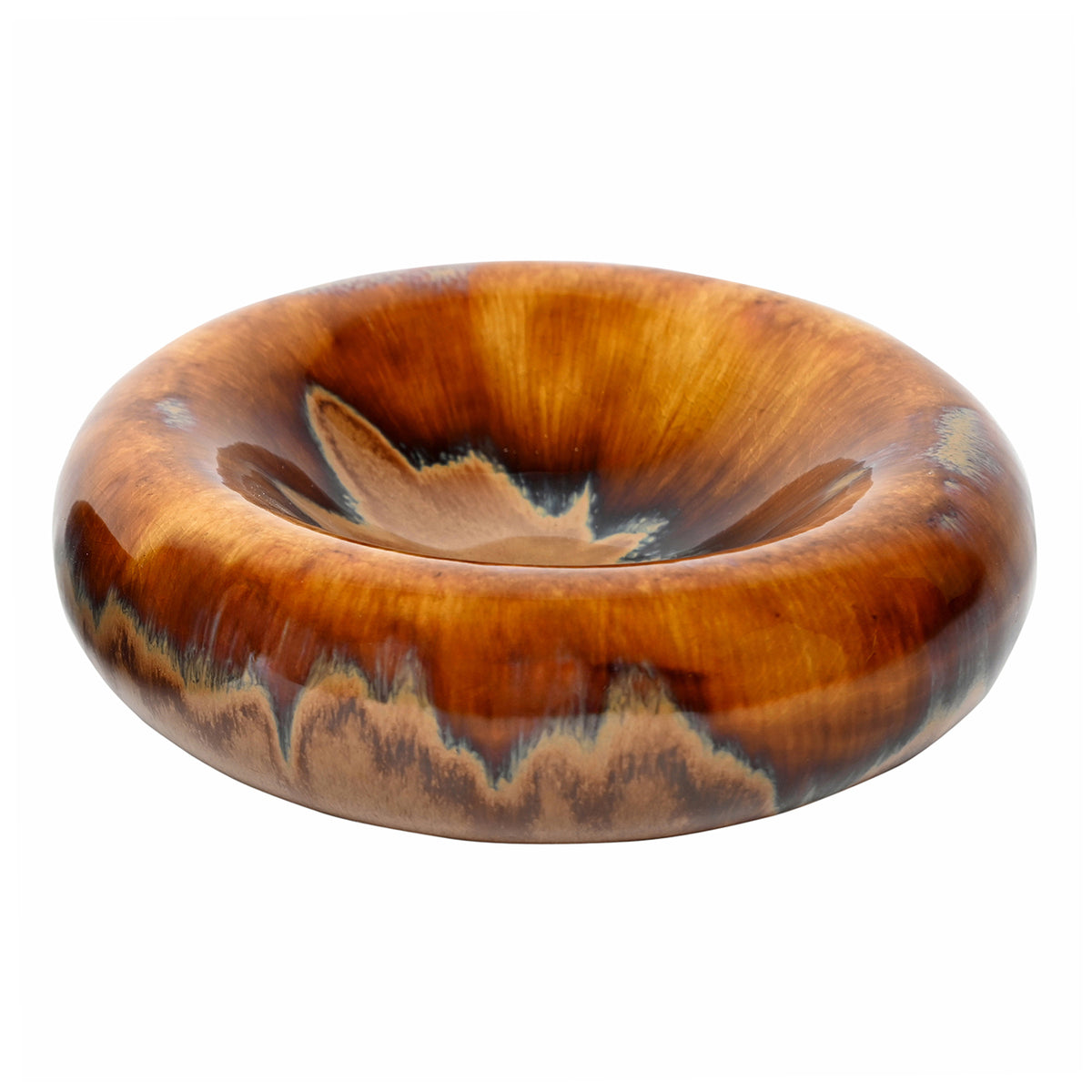 Angled view of Tide bowl showing the broad rounded rim and shallow interior with caramel, ochre and charcoal glaze patterns.