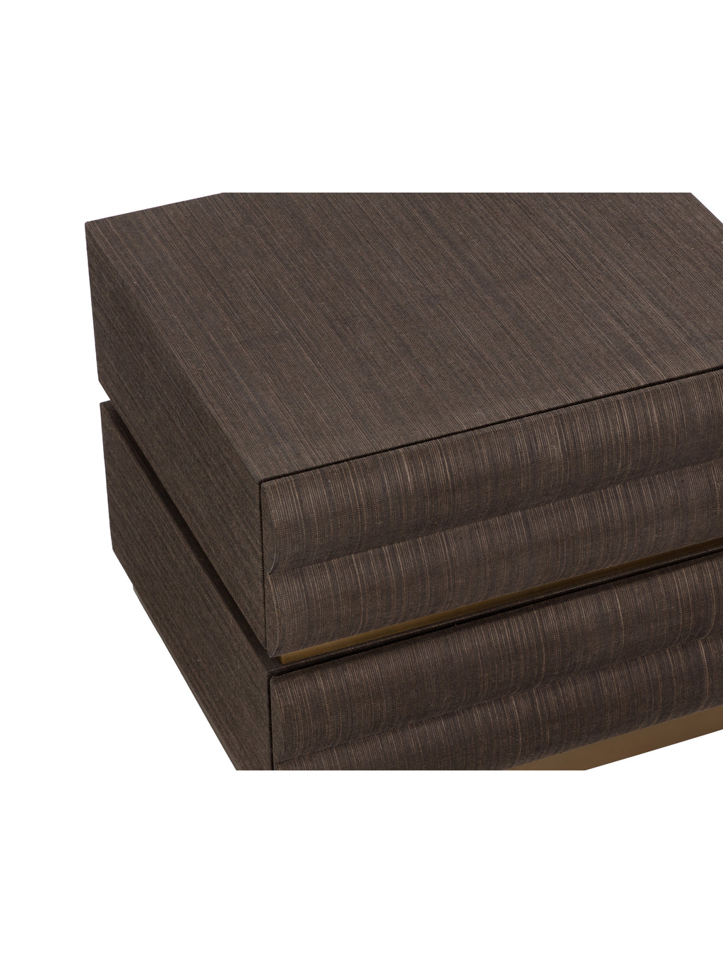 Close view from above of the nightstand's textured brown top and rounded tiers across the drawer fronts.