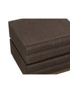 Close view from above of the nightstand's textured brown top and rounded tiers across the drawer fronts.