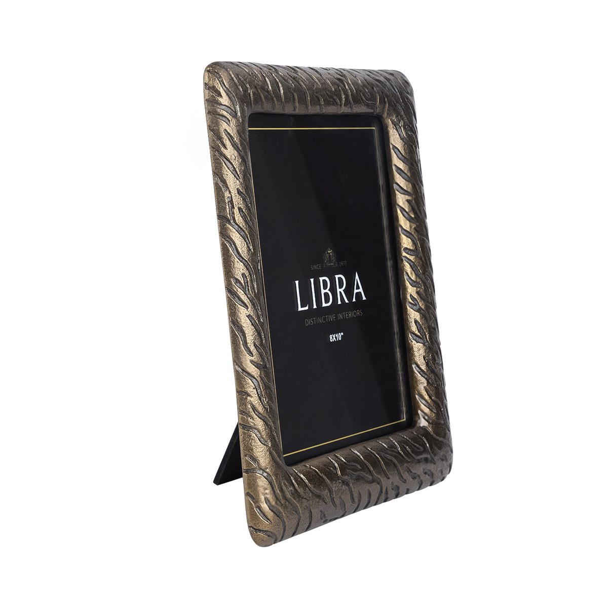 Angled front view of the Tiger photo frame with an antiqued brass finish, broad striped surround and easel visible behind.