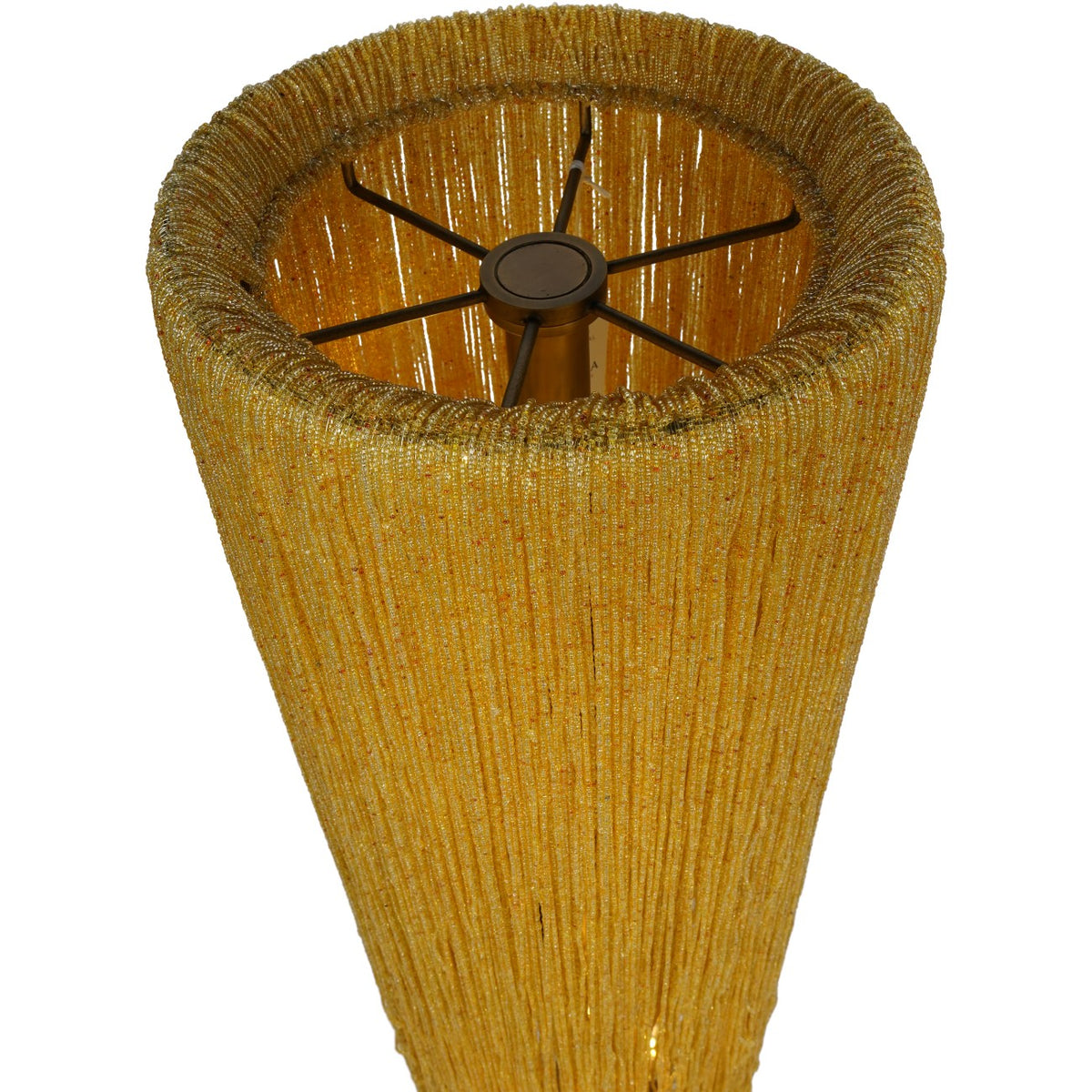 View into the lamp's open circular top, showing closely gathered amber bead strands around the rim and metal supports inside.