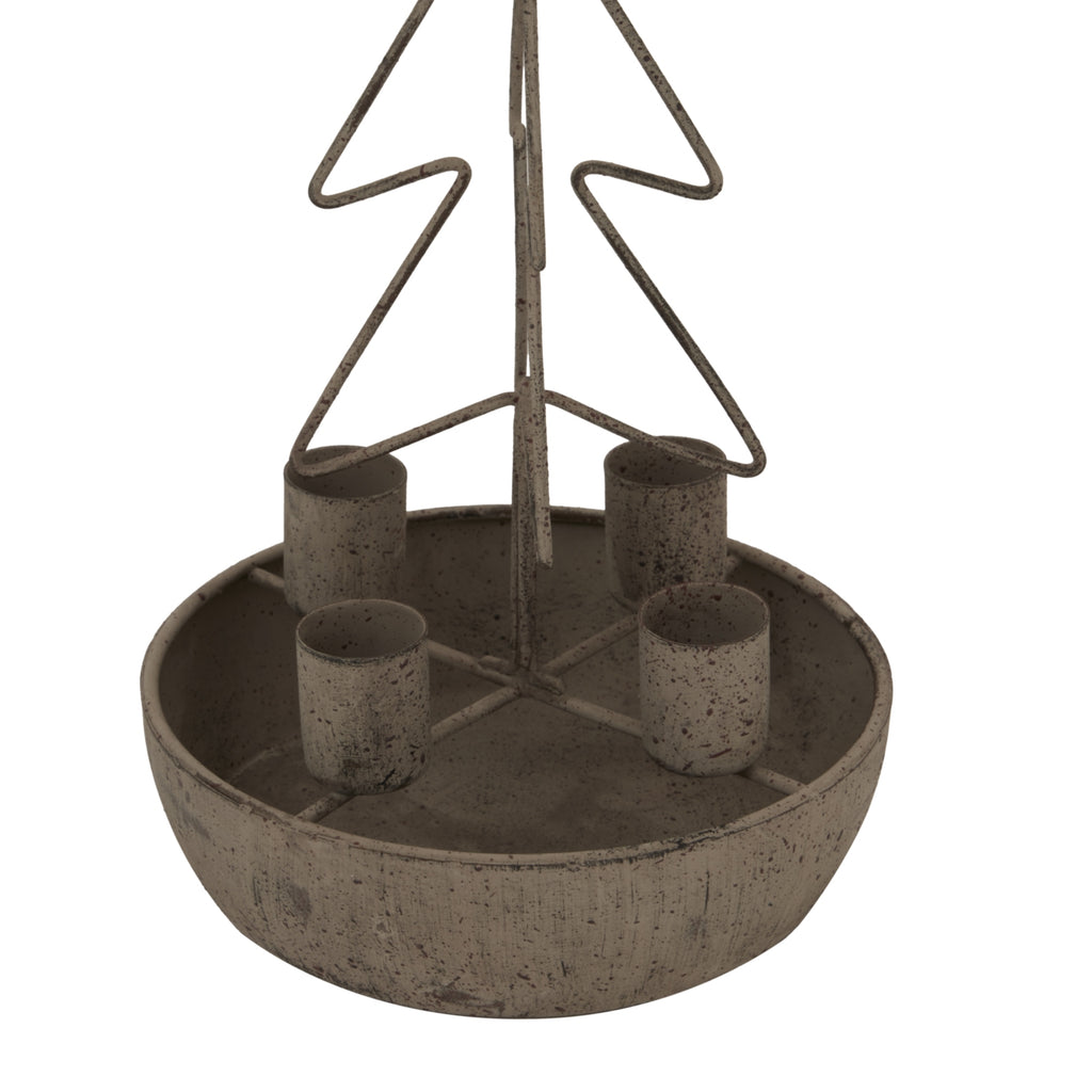 Close-up of the four cylindrical candle cups and round tray, showing the dark speckling of the weathered finish beneath the tree outline.
