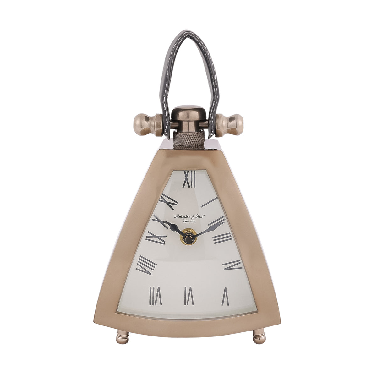 Front view of the Trigon clock with a cream Roman numeral dial, black hands, stitched loop handle and small turned feet.