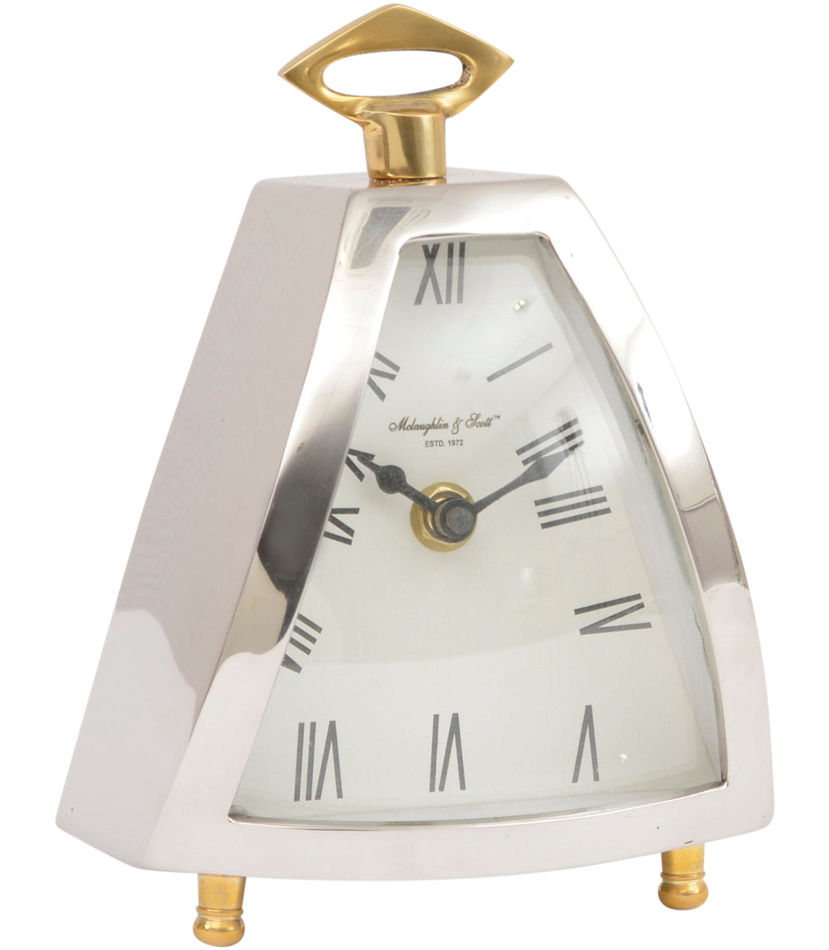 Angled view of the Trigon clock with a tapered silver case, pale Roman numeral dial, ornate dark hands, brass feet and an open diamond-shaped top loop.