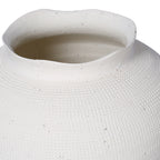 Close-up of the vase's wavy white rim, open interior and finely patterned shoulder.